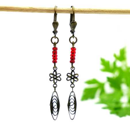 Aged bronze pendant earrings with a red glass bead Basic 19,00 €