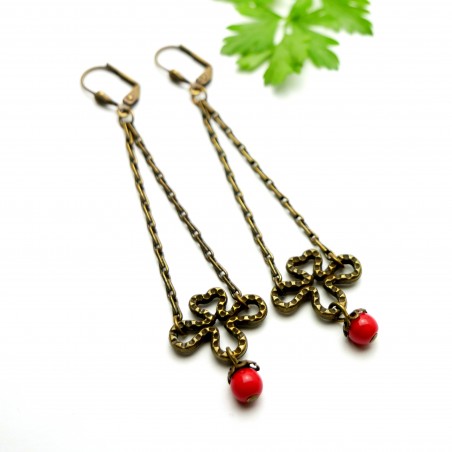 Aged bronze pendant earrings with a red glass bead Basic 27,00 €