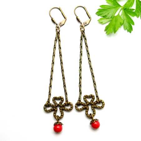 Aged bronze pendant earrings with a red glass bead Basic 27,00 €