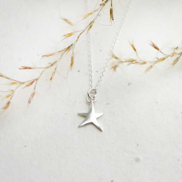 Minimalist sterling silver star pendant on chain
