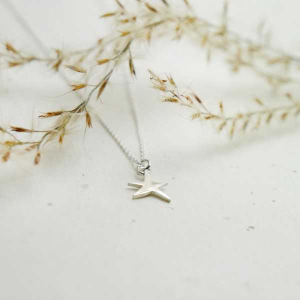 Minimalist sterling silver star pendant on chain