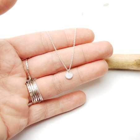 Solitaire necklace with a thin chain and a small minimalist disc