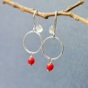 Minimalist round dangling earrings with a small red glass bead in upcycled and recycled 925 silver ♻ for women.
