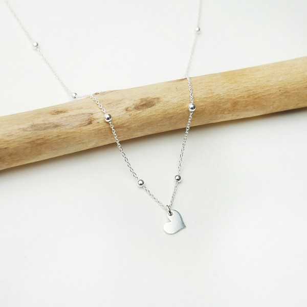 Women's solitary heart pendant in minimalist recycled 925 silver for women on a fine adjustable beaded chain