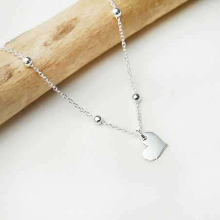 Women's solitary heart pendant in minimalist recycled 925 silver for women on a fine adjustable beaded chain
