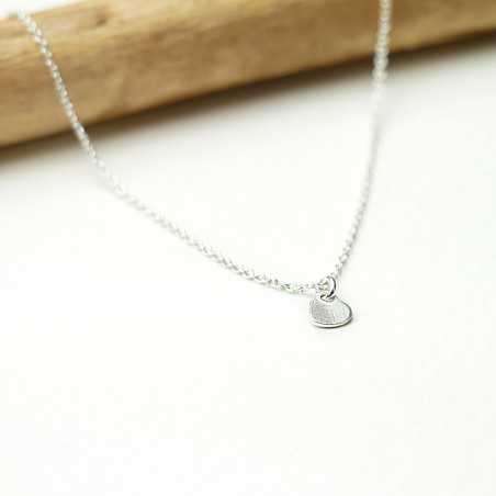 Women's small solitary heart pendant in minimalist recycled 925 silver for women on a fine adjustable chain