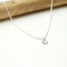 Women's small solitary heart pendant in minimalist recycled 925 silver for women on a fine adjustable chain