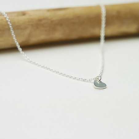 Women's small solitary heart pendant in minimalist recycled 925 silver for women on a fine adjustable chain